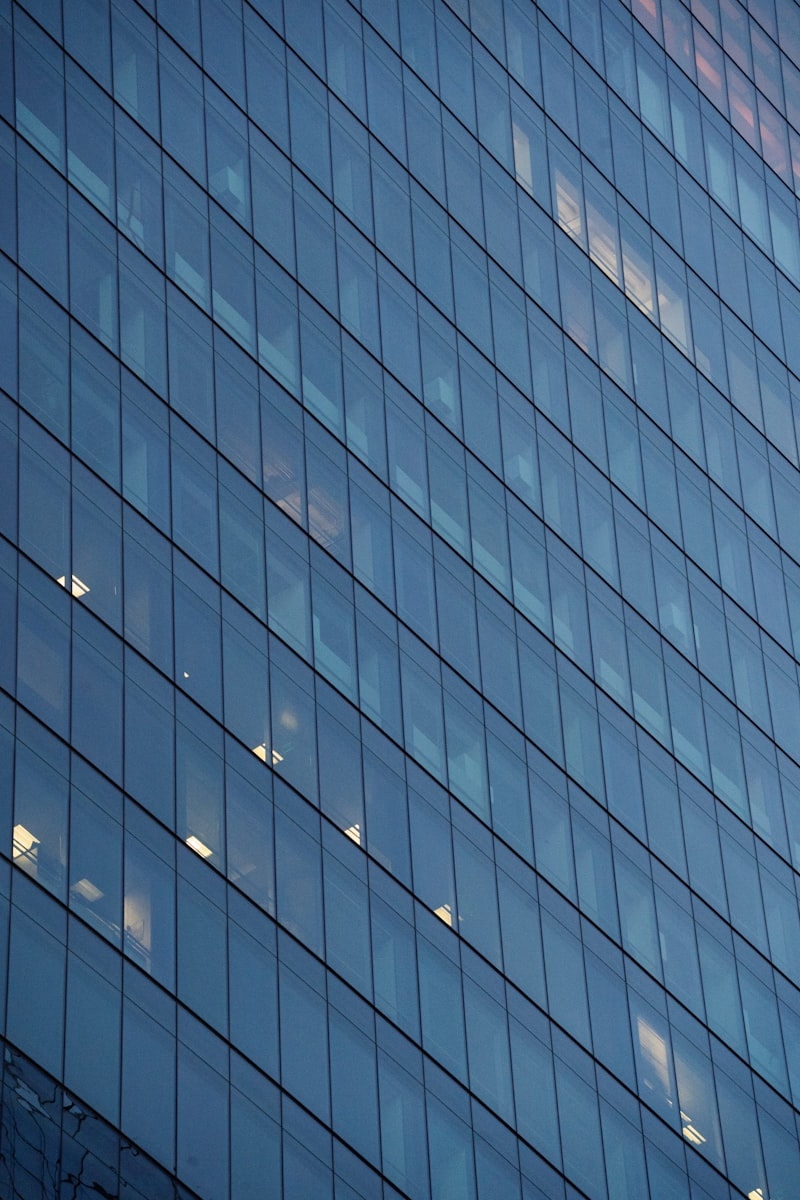 Glass facade of modern office building being cleaned