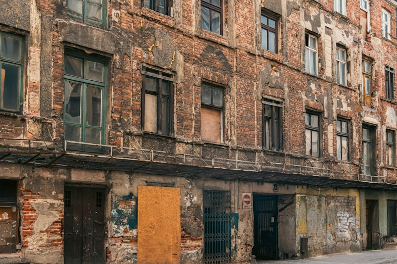 Dilapidated building with peeling paint showing neglected maintenance